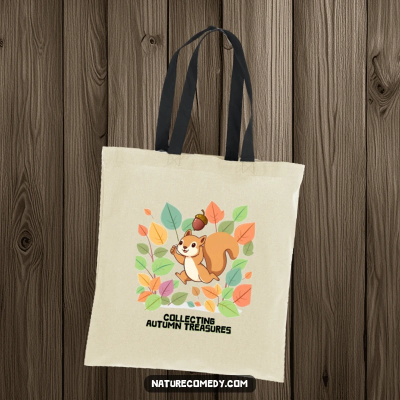 Funny tote bag illustrating a tiny squirrel leaping through a swirl of vibrant autumn leaves, triumphantly holding a small acorn.